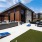 outdoor putting green and cornhole next to grilling area