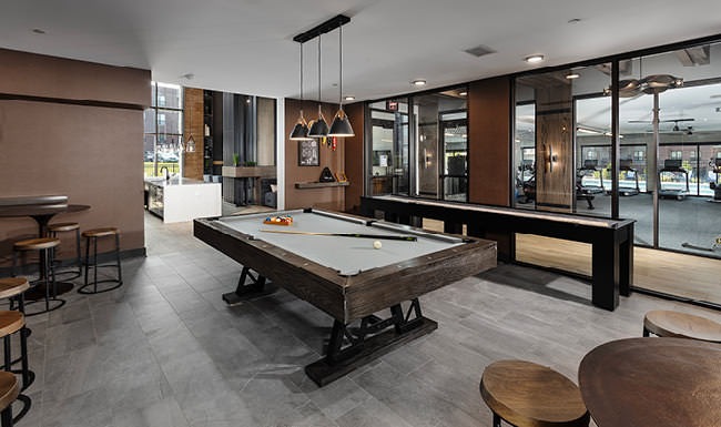 Elevated Living game room with billiards table